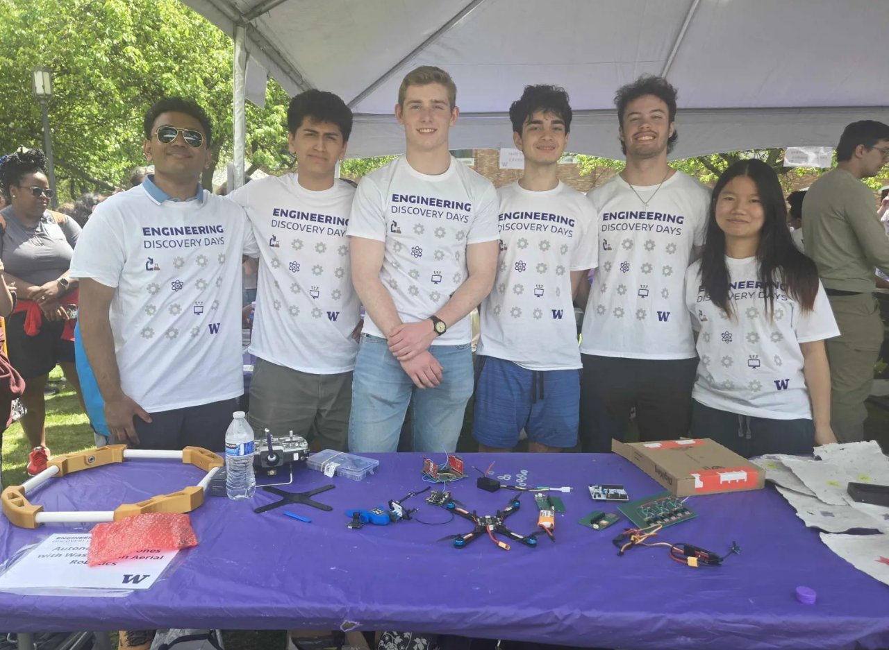 WAAR members at their Engineering Discovery Days booth with drone hardware laid out on the table